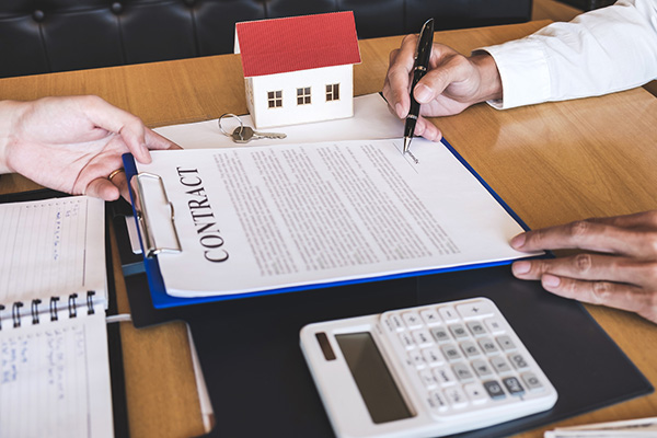Estate agent broker reach contract form to client signing agreement contract real estate with approved mortgage application form, buying or concerning mortgage loan offer for and house insurance