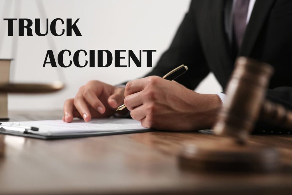 Truck Accident Lawyer Consultation and Legal Claim Review Truck accident legal consultation showing an attorney reviewing and signing documents with a gavel on the desk, symbolizing injury claim representation.