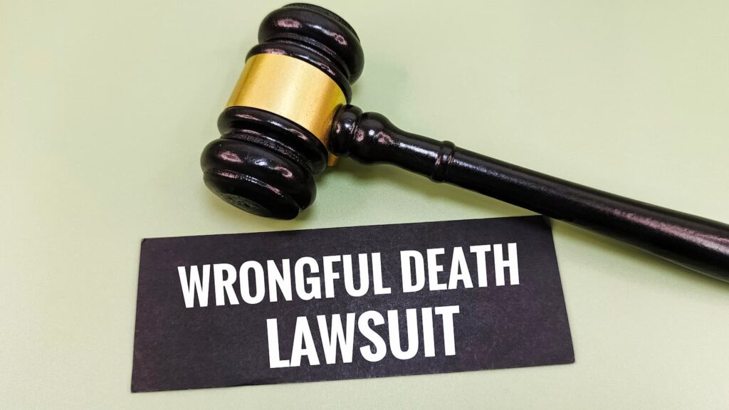 Gavel beside sign reading wrongful death lawsuit, representing legal action and eligibility to file a wrongful death claim