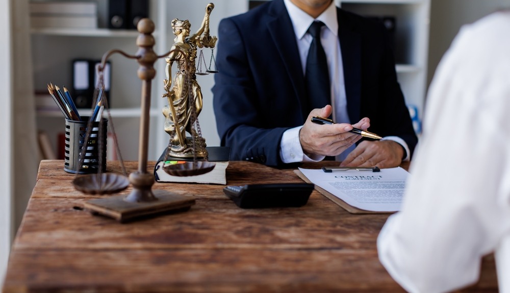 Personal injury lawyer reviewing a claim with a client